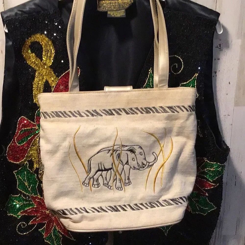 Purse Stitched, elephant embroidery by Marlow, light, staining shown, should cle